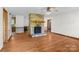 Open-concept living space with hardwood floors, a stone fireplace, and lots of room at 160 Walking Horse Run, Stanley, NC 28164