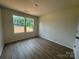 Bedroom with hardwood floors and lots of natural light at 1727 E Cloaninger Ave, Statesville, NC 28625