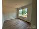 Bedroom featuring hardwood floors and bright natural light at 1727 E Cloaninger Ave, Statesville, NC 28625