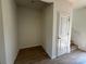 Room featuring a spacious walk-in closet, wood-look flooring and white walls at 1727 E Cloaninger Ave, Statesville, NC 28625