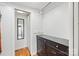 Walk-in closet with storage system, access to a bathroom, and ample space for organization at 208 Island View Rd, Mount Holly, NC 28120
