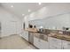 Bright, open kitchen featuring stainless steel appliances, granite countertops, and ample cabinet space at 208 Island View Rd, Mount Holly, NC 28120