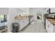 Bright kitchen featuring ample counter space, stainless steel appliances, and tile flooring at 208 Island View Rd, Mount Holly, NC 28120