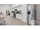 Spacious kitchen featuring stainless steel appliances, granite countertops, and white cabinetry at 208 Island View Rd, Mount Holly, NC 28120