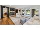 Inviting living room features a stone fireplace, a comfortable couch and access to lake views and a jacuzzi at 208 Island View Rd, Mount Holly, NC 28120
