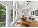 Bright living room featuring large windows with lake views and comfortable seating areas at 208 Island View Rd, Mount Holly, NC 28120