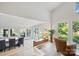 Bright living room featuring lake views, a dining area, and stylish decor at 208 Island View Rd, Mount Holly, NC 28120