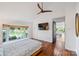 Relaxing main bedroom with lake views, ceiling fan, and private access to the living area at 208 Island View Rd, Mount Holly, NC 28120