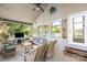 Inviting screened-in porch with tile floor, comfortable seating, and views of the backyard at 208 Island View Rd, Mount Holly, NC 28120