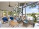 Bright screened porch with lake views, comfortable seating and plenty of natural light at 208 Island View Rd, Mount Holly, NC 28120