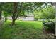 Lush backyard with a detached garage and vibrant hydrangea bushes at 2215 Hodgin St, Gastonia, NC 28056
