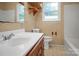 Bathroom with tile floors, sink, toilet and tub at 2215 Hodgin St, Gastonia, NC 28056