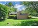 Well-maintained brick house with lawn, mature trees offering shade at 2215 Hodgin St, Gastonia, NC 28056