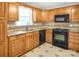 Well-equipped kitchen featuring ample counter space, oak cabinets at 2215 Hodgin St, Gastonia, NC 28056