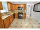 Bright kitchen with wood cabinets, granite counters, modern appliances at 2215 Hodgin St, Gastonia, NC 28056