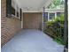 Covered front porch with brick wall and metal railing at 2215 Hodgin St, Gastonia, NC 28056