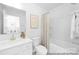 Well-lit bathroom featuring a bathtub and vanity with modern fixtures at 233 Wheatfield Dr # 102P, Statesville, NC 28677