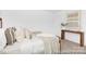 Elegant bedroom with plush pillows, stylish decor, and a wooden console table creating a comfortable retreat at 233 Wheatfield Dr # 102P, Statesville, NC 28677
