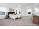 Spacious bedroom featuring multiple windows, plush carpet, and a modern ensuite at 233 Wheatfield Dr # 102P, Statesville, NC 28677