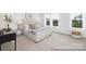 Inviting bedroom featuring a bright window, chic decor, and a cozy ambiance for relaxation at 233 Wheatfield Dr # 102P, Statesville, NC 28677