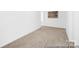Spacious bedroom with plush carpeting and ample natural light creates a cozy retreat at 233 Wheatfield Dr # 102P, Statesville, NC 28677