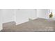 Bright bedroom featuring neutral carpeting, white walls and modern design elements at 233 Wheatfield Dr # 102P, Statesville, NC 28677