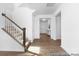 Inviting foyer with wood floors, staircase, and access to various rooms at 233 Wheatfield Dr # 102P, Statesville, NC 28677