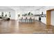Open concept kitchen with sleek modern appliances, an island with seating, and bright lighting at 233 Wheatfield Dr # 102P, Statesville, NC 28677