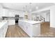 Spacious kitchen with a large central island, stainless steel appliances, and lots of counter space at 233 Wheatfield Dr # 102P, Statesville, NC 28677