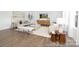 Bright living room featuring neutral-colored furniture, modern decor, and lots of natural light at 233 Wheatfield Dr # 102P, Statesville, NC 28677