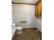 Neutral bathroom features a toilet, vanity with granite countertop, and tiled flooring at 2515 Myra Ln, Lincolnton, NC 28092