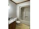 Bathroom features a toilet, sink with granite counters, and shower tub combo at 2515 Myra Ln, Lincolnton, NC 28092