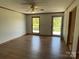 Bright bedroom with wood flooring, two windows and a ceiling fan at 2515 Myra Ln, Lincolnton, NC 28092