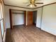 Spacious bedroom features hardwood floors, a ceiling fan, and a closet at 2515 Myra Ln, Lincolnton, NC 28092
