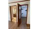 Bedroom with wood flooring showcases a bathroom and closet; natural light at 2515 Myra Ln, Lincolnton, NC 28092