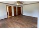Bedroom featuring wood flooring and access to a bathroom and walk-in closet at 2515 Myra Ln, Lincolnton, NC 28092