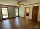 Bedroom with wood flooring, natural light, ceiling fan, and access to a bathroom at 2515 Myra Ln, Lincolnton, NC 28092
