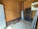 Garage space with a water heater and ample room for storage or other uses at 2515 Myra Ln, Lincolnton, NC 28092