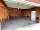 Spacious garage featuring wooden shelving for ample storage solutions at 2515 Myra Ln, Lincolnton, NC 28092