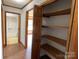 Hallway and closet with built in shelving units at 2515 Myra Ln, Lincolnton, NC 28092