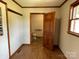 Hallway with wood floors leads to a bathroom, featuring neutral walls and natural light at 2515 Myra Ln, Lincolnton, NC 28092