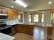 Modern kitchen featuring stainless steel appliances, granite countertops, and hardwood floors at 2515 Myra Ln, Lincolnton, NC 28092