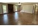 Spacious living room featuring a brick fireplace, hardwood floors, and bright natural light at 2515 Myra Ln, Lincolnton, NC 28092