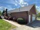 Well-maintained brick house featuring a manicured lawn and established landscaping at 2515 Myra Ln, Lincolnton, NC 28092