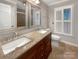 Well-appointed bathroom with double sinks, granite countertops, and a shower, creating a functional and stylish space at 27 Quayside Ct, Clover, SC 29710