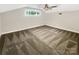 Bedroom with neutral carpet, ceiling fan and window providing natural light at 27 Quayside Ct, Clover, SC 29710