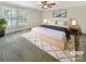 Comfortable primary bedroom with ample natural light, a ceiling fan, and a decorative area rug at 27 Quayside Ct, Clover, SC 29710