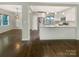 Open-concept kitchen with stainless steel appliances, white cabinets, and a breakfast bar at 27 Quayside Ct, Clover, SC 29710