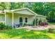 Inviting front porch with brick path, comfortable seating, and well-maintained landscaping details at 2984 Starnes Dr, Rock Hill, SC 29730