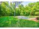 Large, well-maintained front yard with driveway and lush landscaping, enhancing the property's curb appeal at 2984 Starnes Dr, Rock Hill, SC 29730